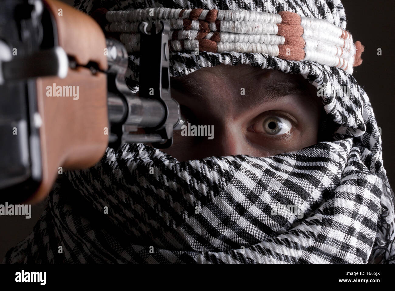 Portrait of scared aimed middle eastern man Stock Photo
