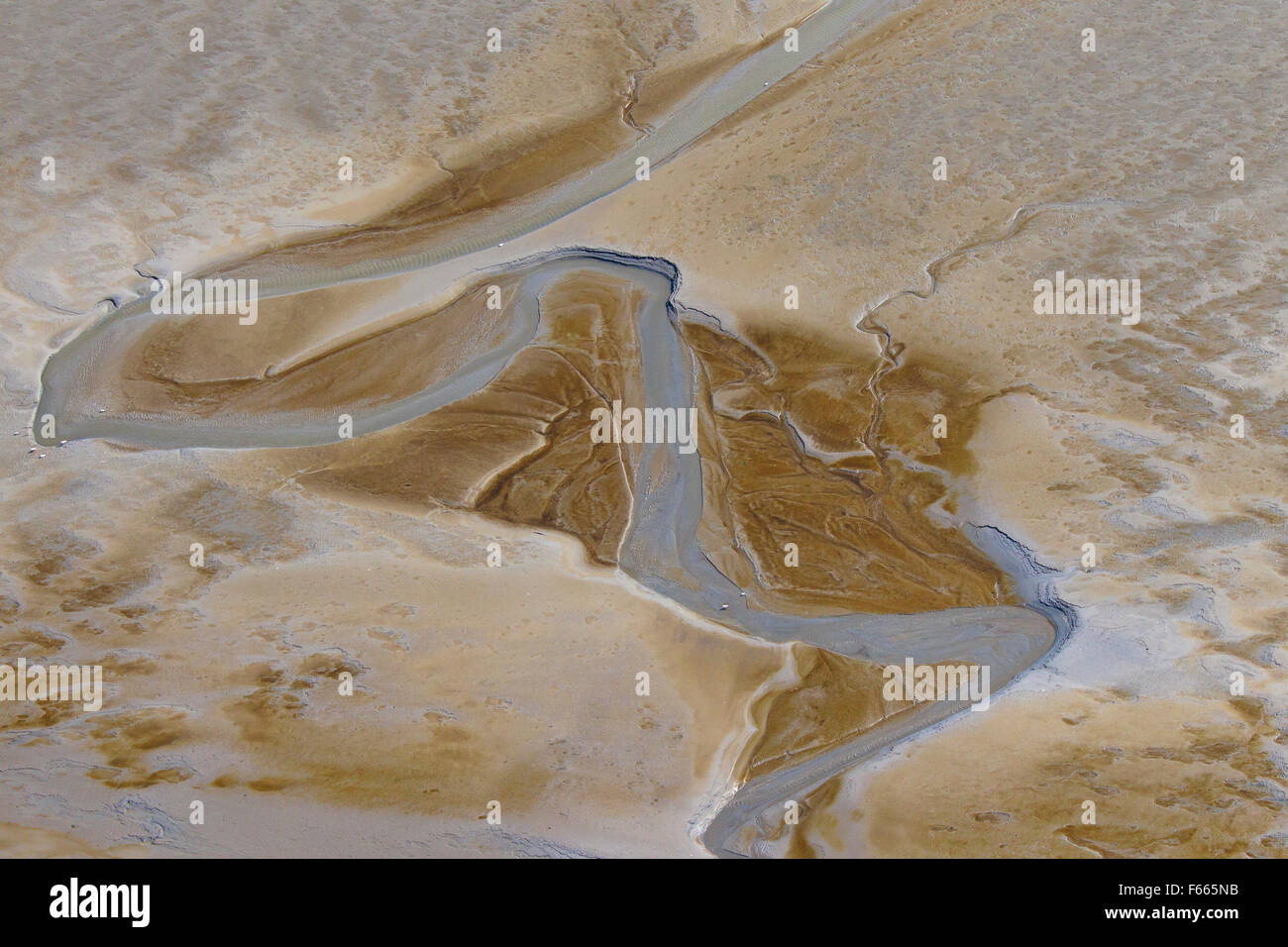 Aerial view of stream running through tidal mudflat at the Schleswig-Holstein Wadden Sea National Park, Germany Stock Photo