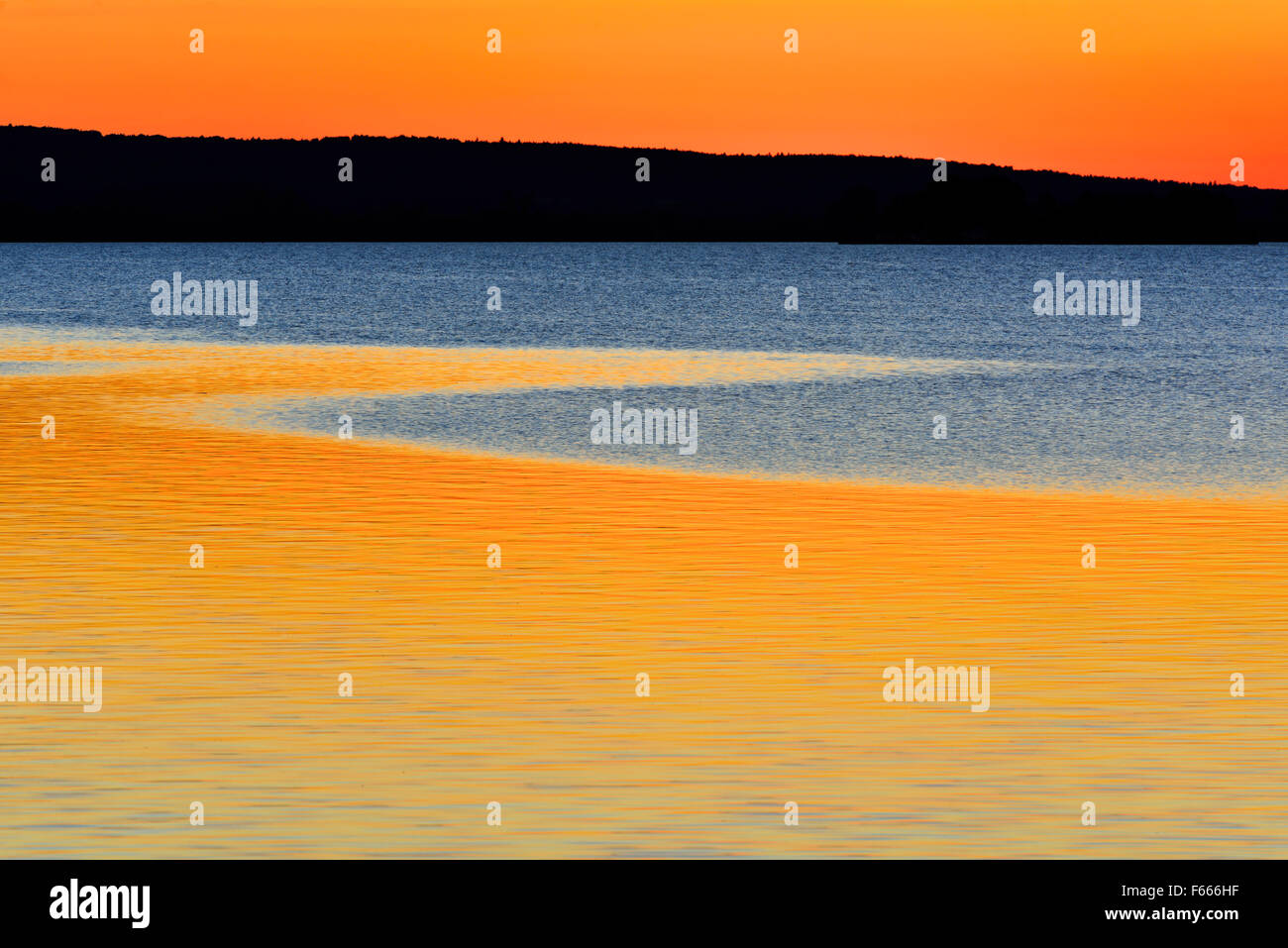 Red sunset reflected in water, Lake Steinhuder, Steinhude, Lower Saxony, Germany Stock Photo