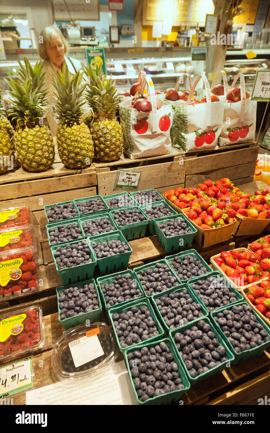 Fresh blueberries and fruit produce in a Farmers Market grocery store, Woodstock, Vermont VT USA