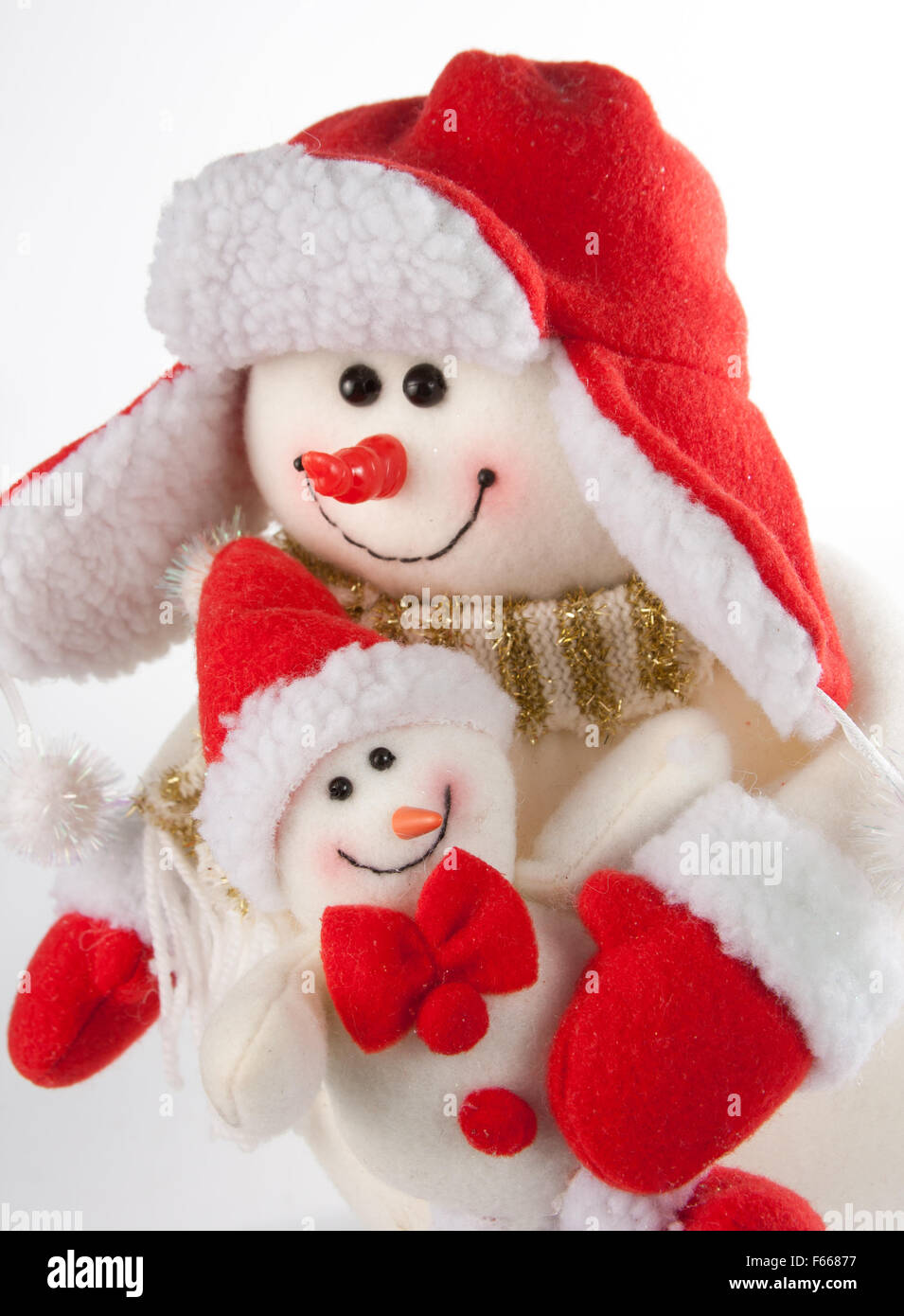 Two christmas snowmen isolated on white background Stock Photo - Alamy