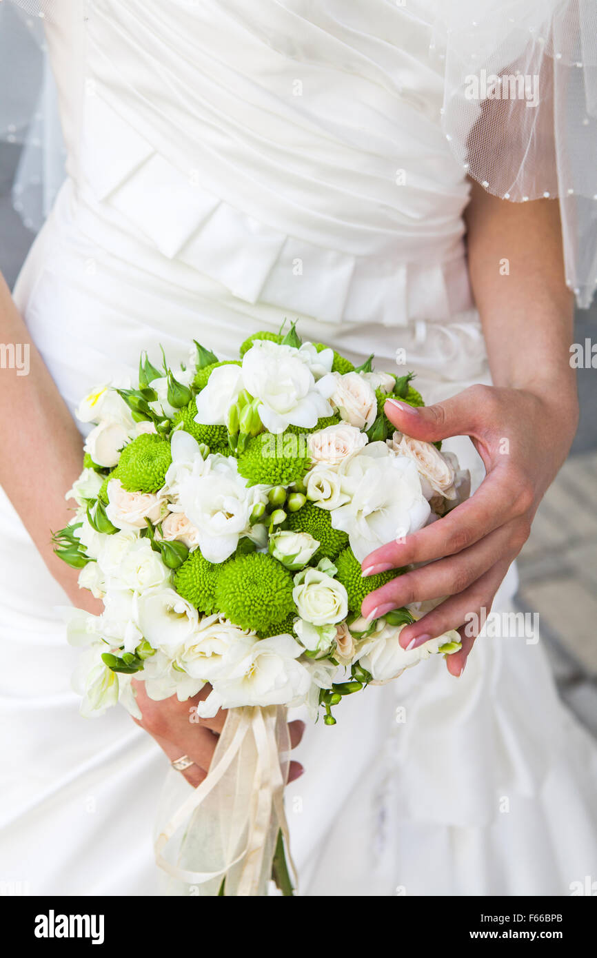 Beautiful wedding bouquet in hands of the bride Stock Photo - Alamy
