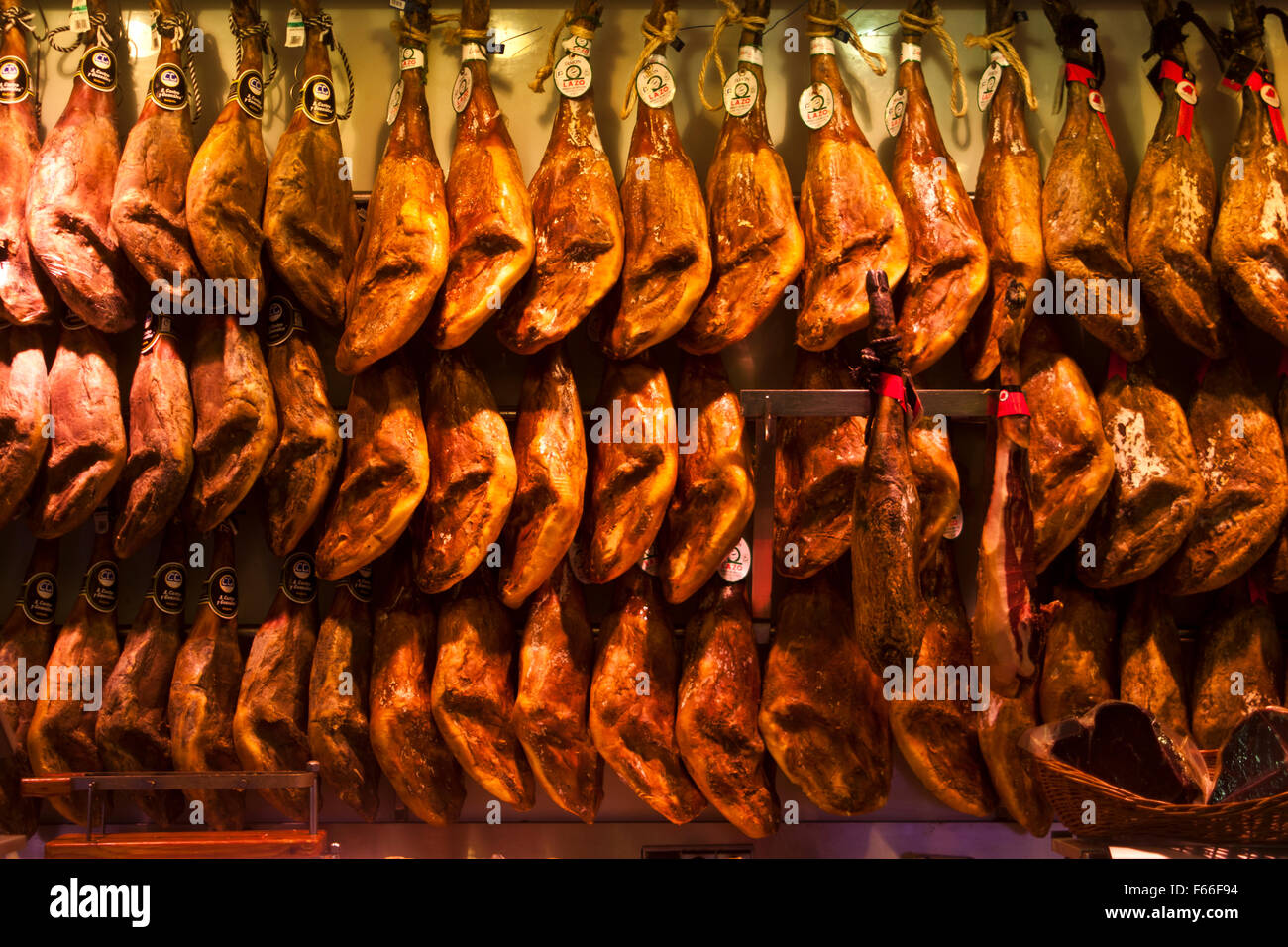 A selection of dry cured Spanish hams (jamon) in the Mercado Colon