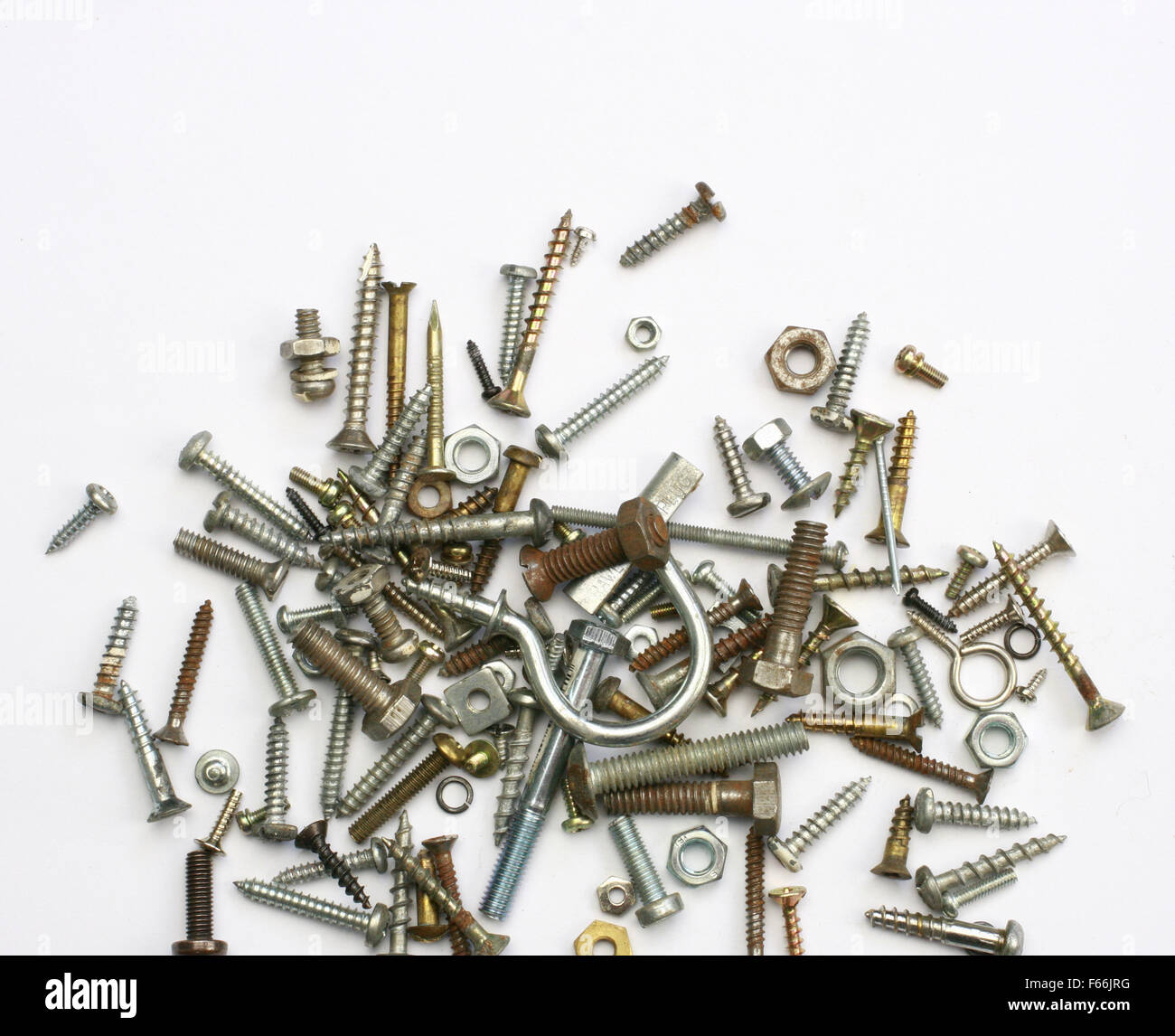 A pile of nuts,bolts, screws and other fasteners on a white background Stock Photo