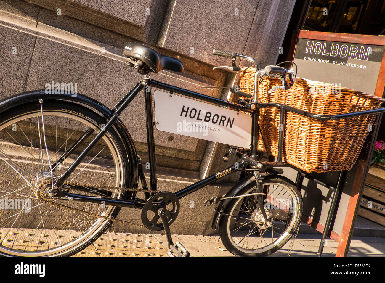 Delivery bicycle outside shop, London, England, U.K. Stock Photo