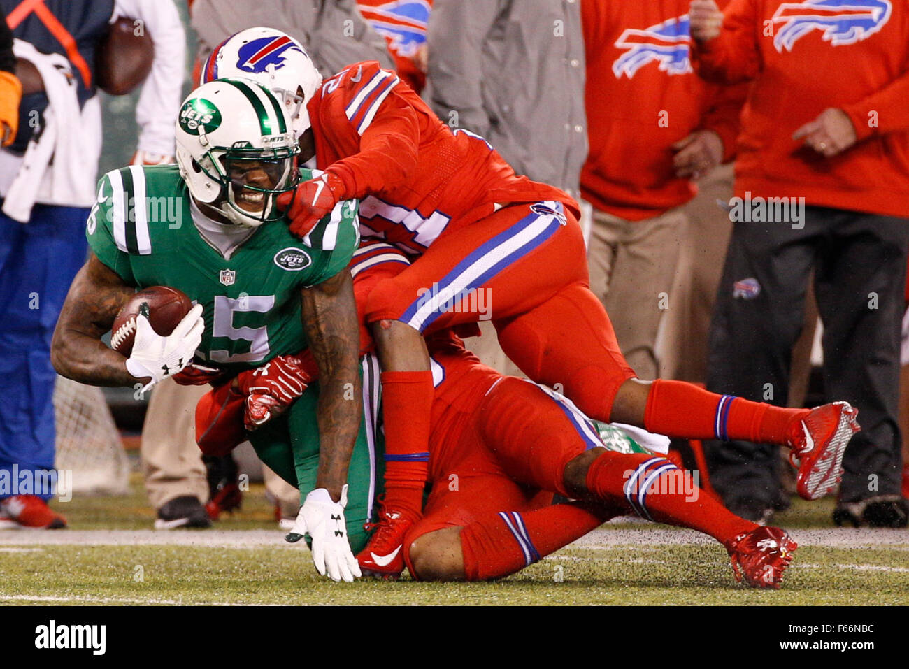 East Rutherford, New Jersey, USA. 12th Nov, 2015. New York Jets wide receiver Brandon Marshall (15) gets tackled by Buffalo Bills cornerback Leodis McKelvin (21) and cornerback Ronald Darby (28) after making the catch during the NFL game between the Buffalo Bills and the New York Jets at MetLife Stadium in East Rutherford, New Jersey. The Buffalo Bills won 22-17. Christopher Szagola/CSM/Alamy Live News Stock Photo