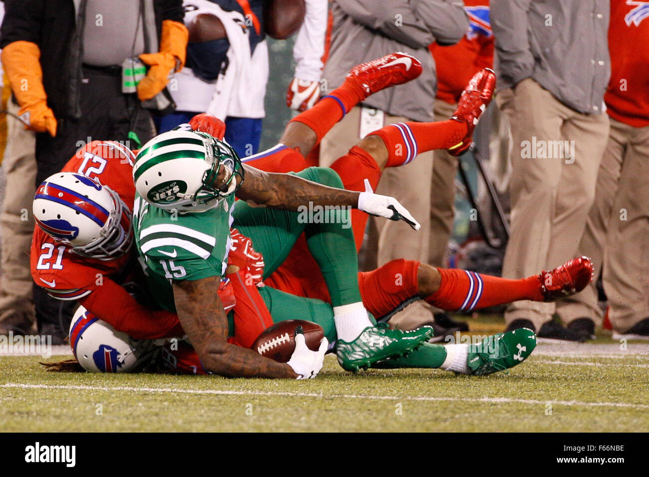 East Rutherford, New Jersey, USA. 12th Nov, 2015. New York Jets wide receiver Brandon Marshall (15) gets tackled by Buffalo Bills cornerback Leodis McKelvin (21) and cornerback Ronald Darby (28) after making the catch during the NFL game between the Buffalo Bills and the New York Jets at MetLife Stadium in East Rutherford, New Jersey. The Buffalo Bills won 22-17. Christopher Szagola/CSM/Alamy Live News Stock Photo
