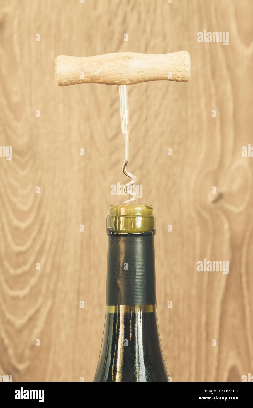 Bottle of wine with corkscrew in wine cork Stock Photo