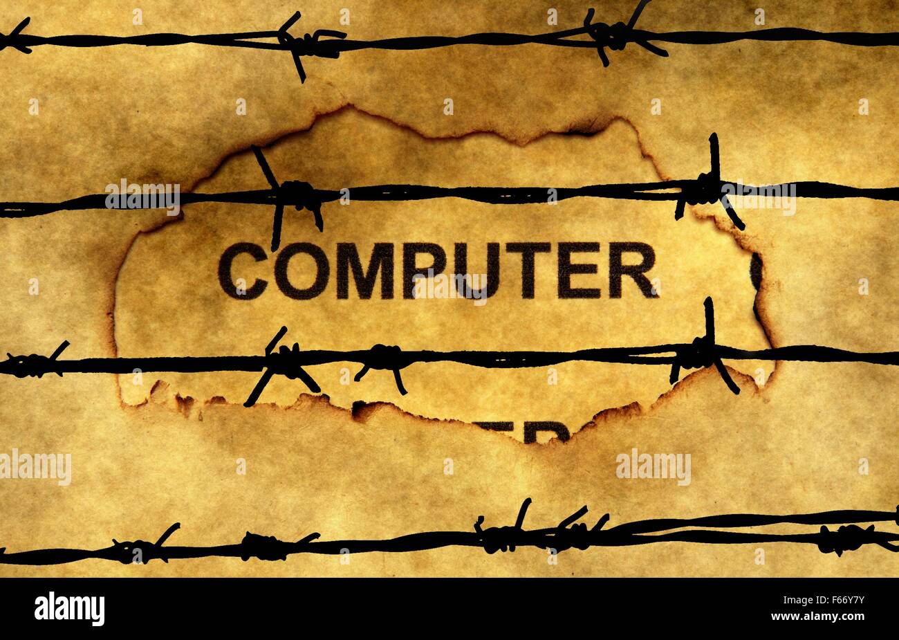 Computer text on paper hole against barbwire Stock Photo - Alamy