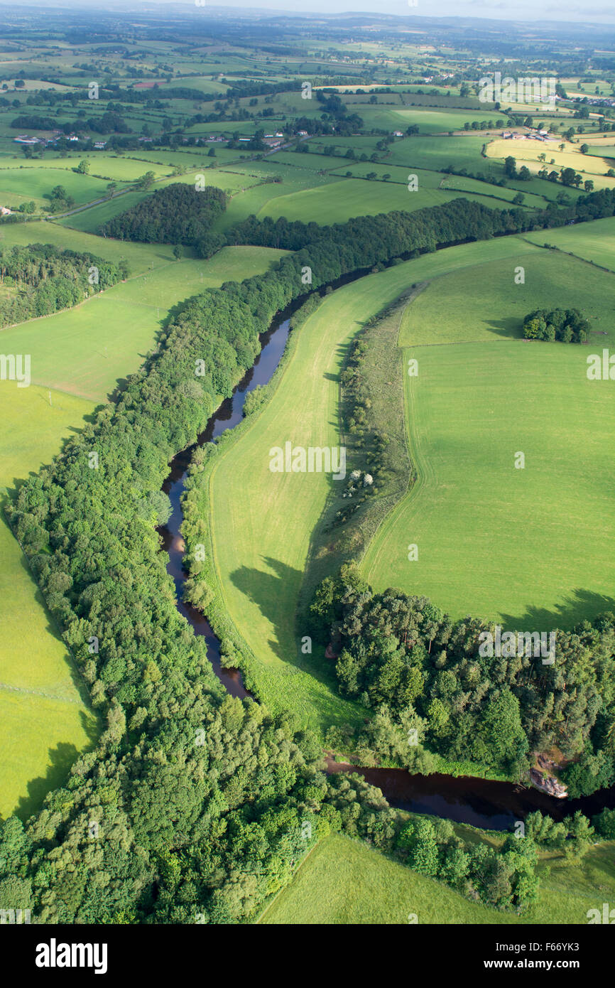 River Eden, edged by native woodland, winding through the countryside near Appleby, Cumbria, UK. Stock Photo