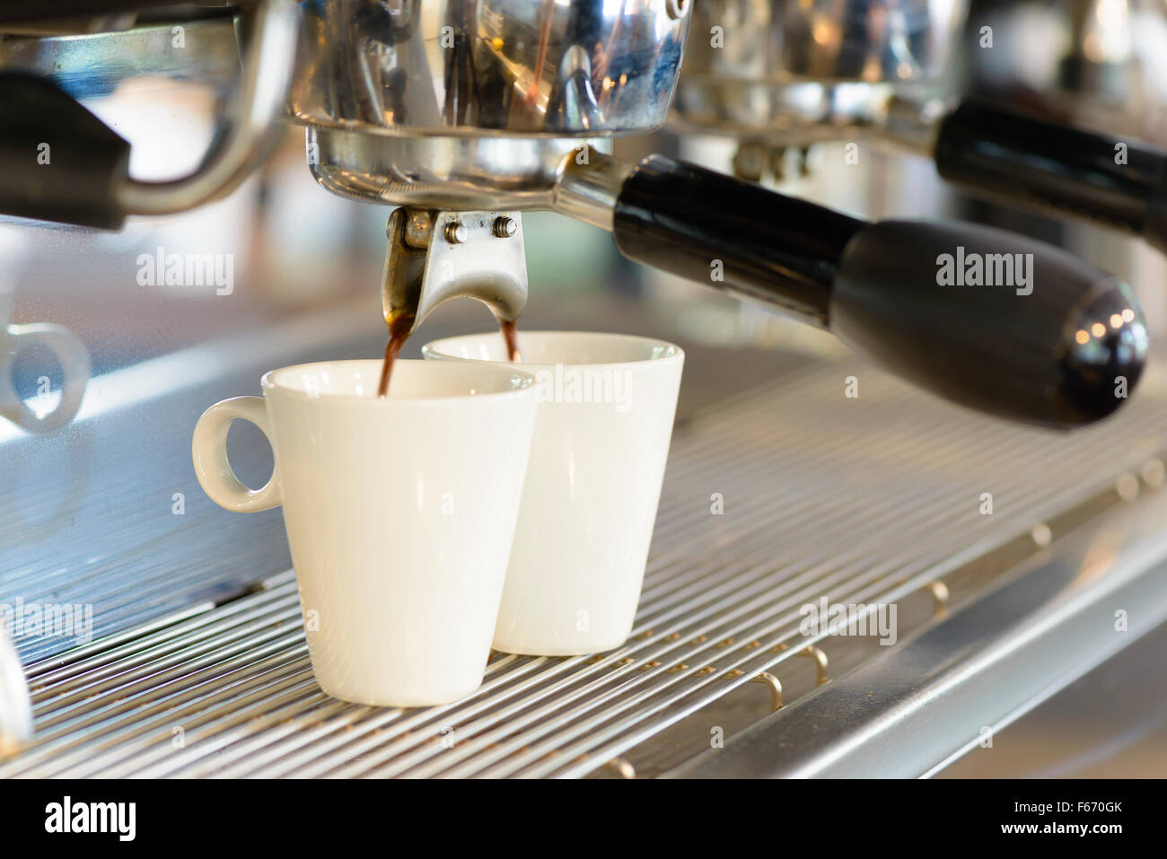 Espresso machine, hot water dispenser and coffee grinder in a bar Stock  Photo - Alamy