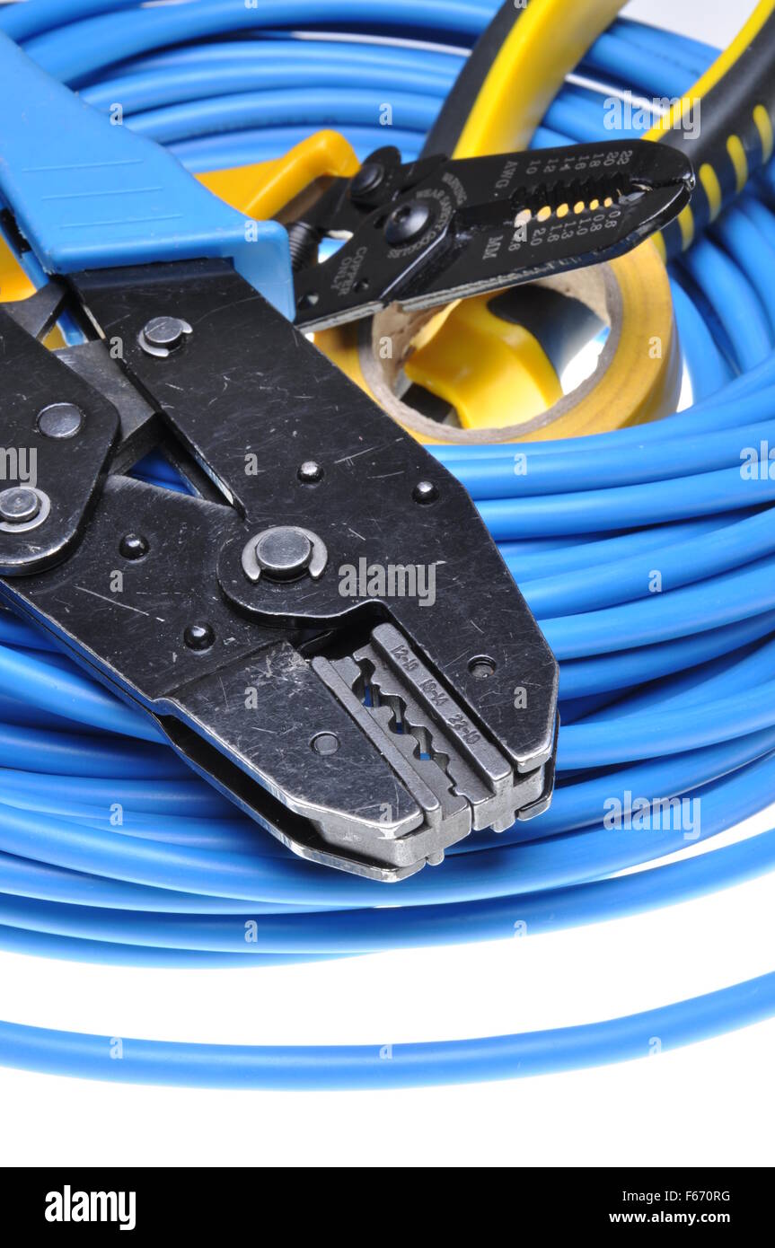Crimping tool and cables isolated on white background Stock Photo - Alamy