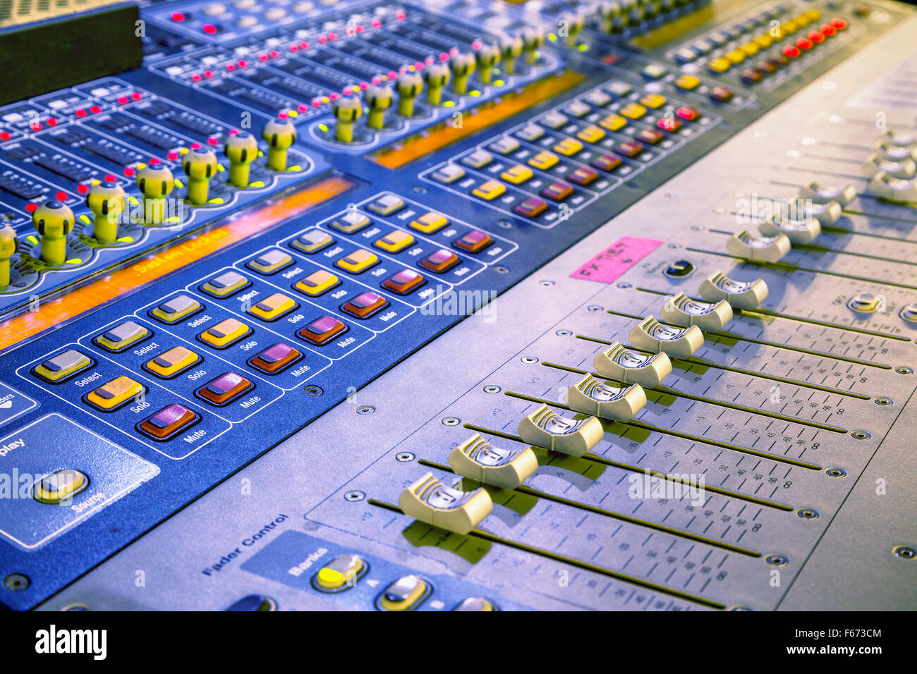 Audio mixer mixing board fader and knobs, Music mixing console buttons. Selective focused Stock Photo -