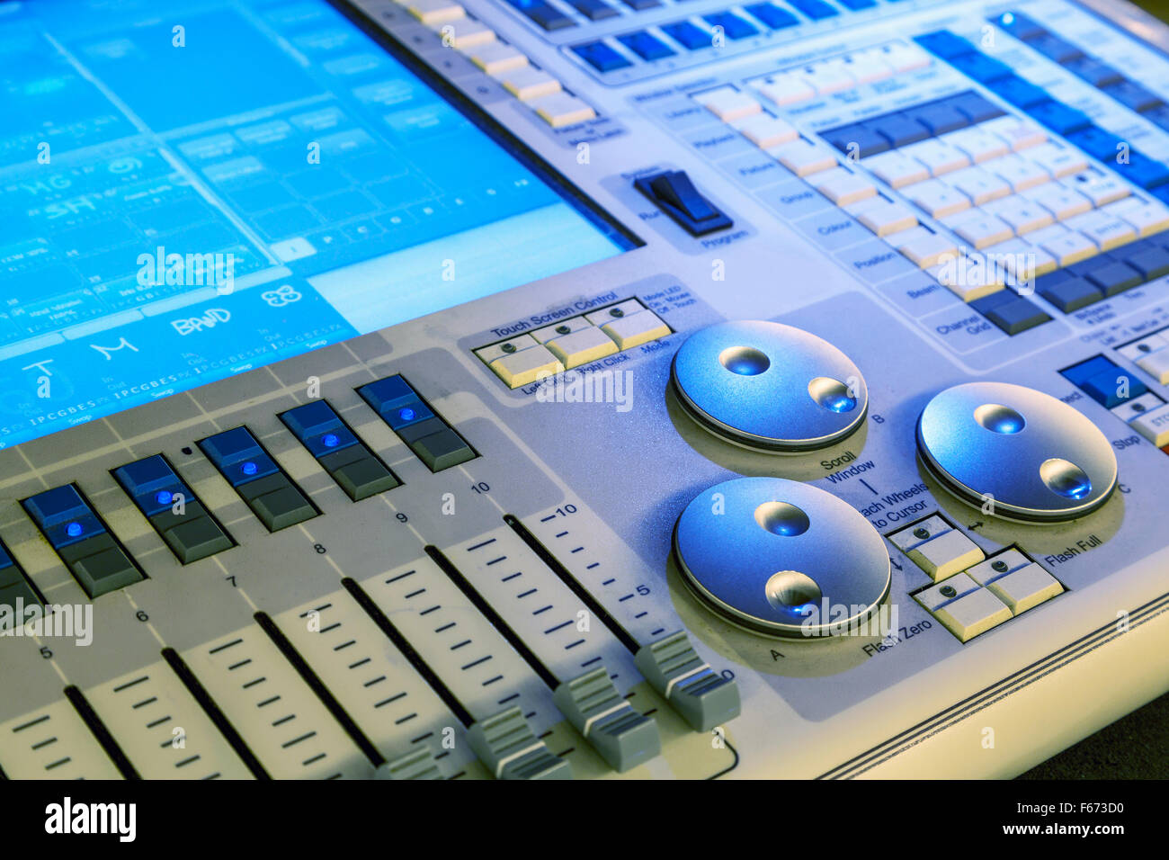 Audio mixer mixing board fader and knobs, Music mixing console with backlit buttons. Selective
