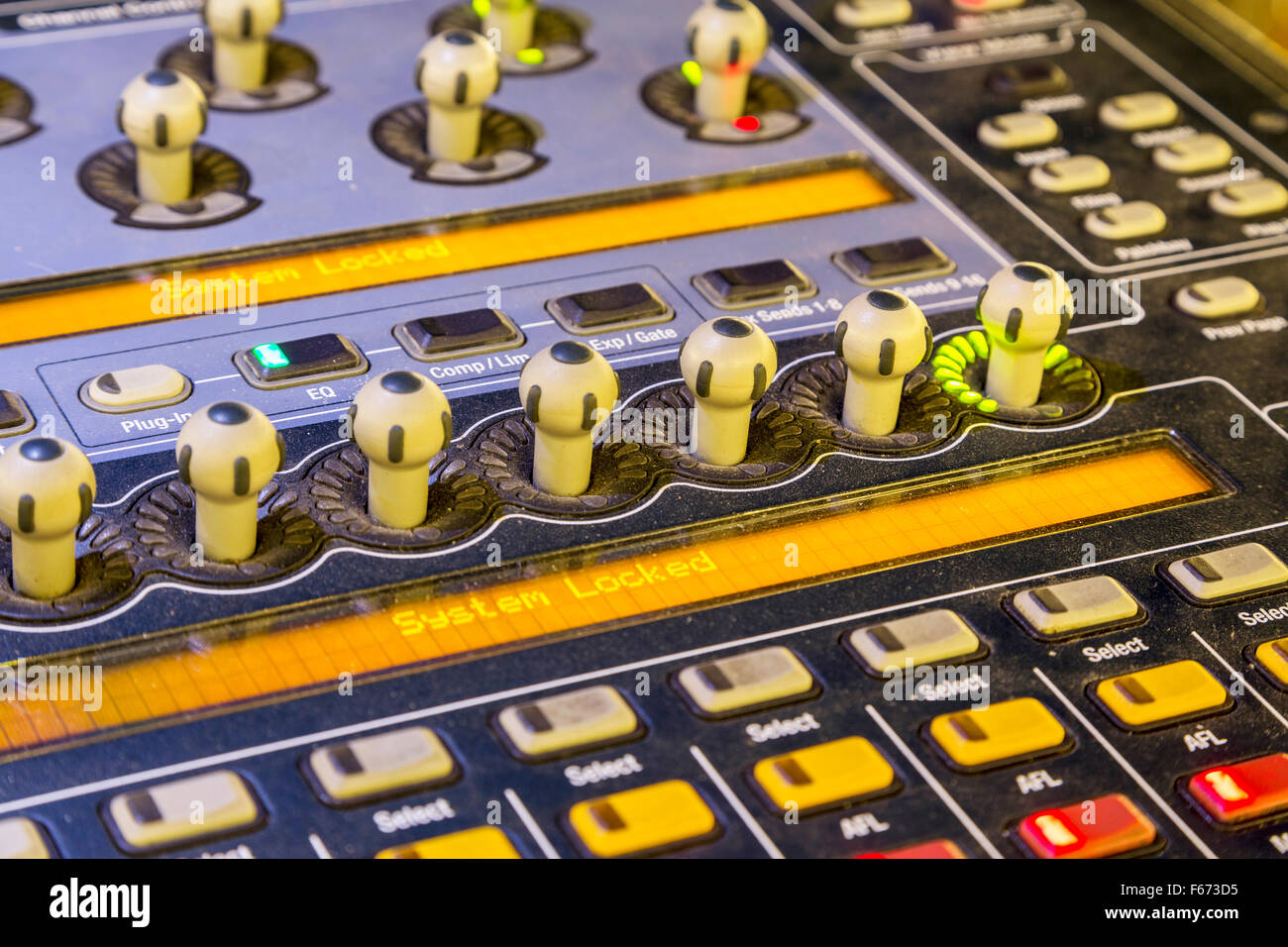Audio mixer mixing board fader and knobs, Music mixing console with backlit buttons. Selective