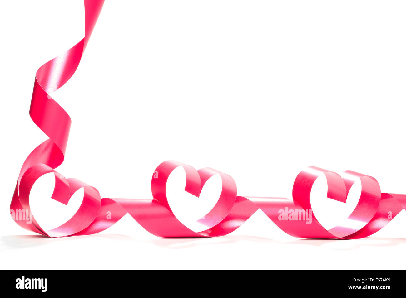 red heart ribbon isolated on white background Stock Photo - Alamy