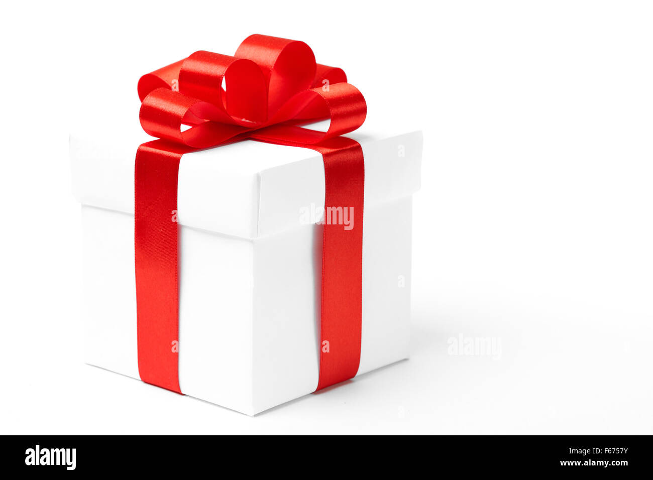 White gift box with red ribbon bow Stock Photo - Alamy