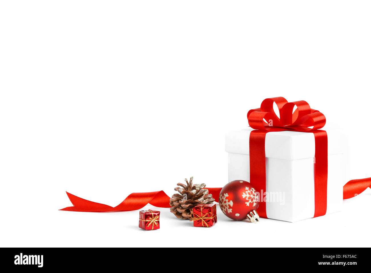 christmas gift with red balls bow Stock Photo - Alamy