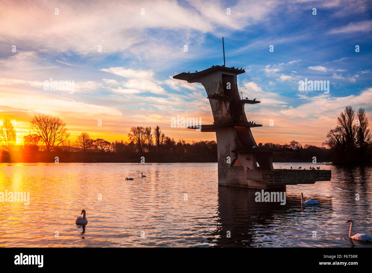The old diving board at Coate Water in Swindon at dawn Stock Photo Alamy