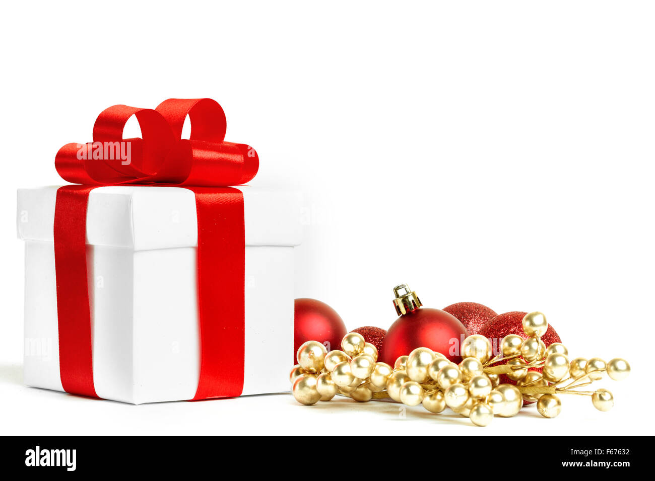 christmas gift with red balls bow Stock Photo - Alamy