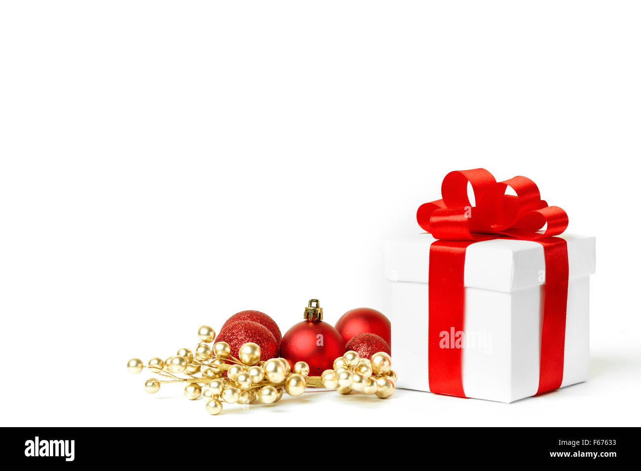 christmas gift with red balls bow Stock Photo - Alamy
