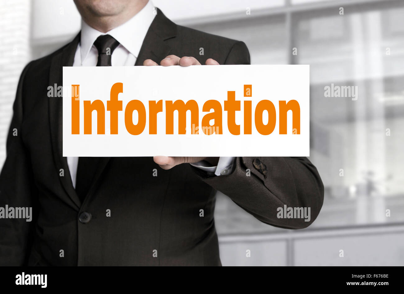 Information sign is held by businessman concept Stock Photo - Alamy