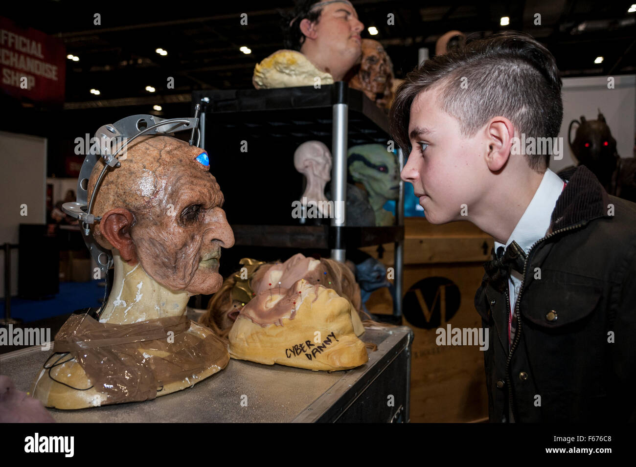 London, UK.  13 November 2015.  A boy meets the character Davros in the prosthetics display as fans gather at the Excel Centre for the opening of the three day Doctor Who Festival.  The event is a celebration of all things Doctor Who - from costumes, behind the scenes, monsters and more. Credit:  Stephen Chung / Alamy Live News Stock Photo