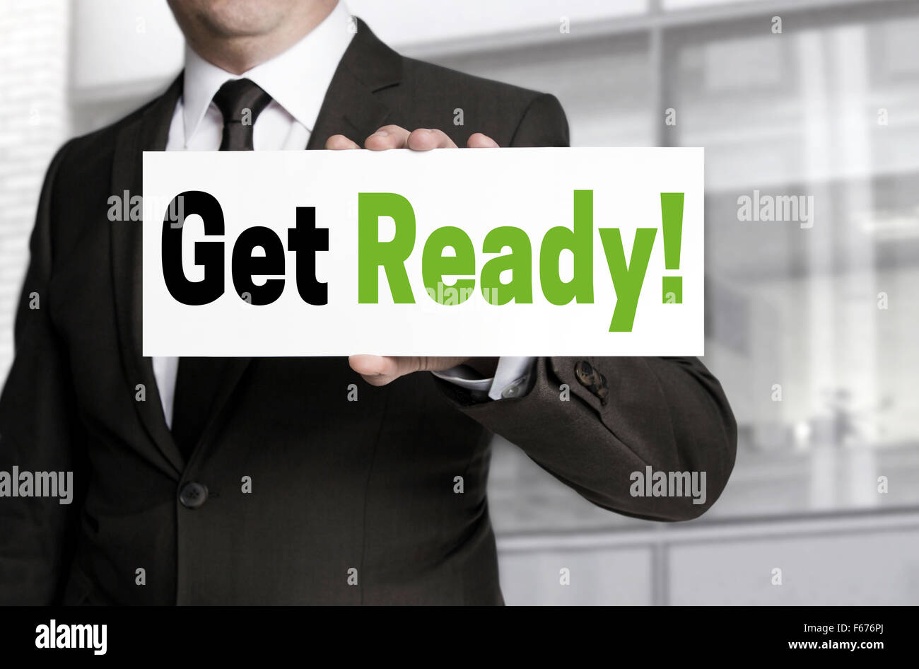 Get ready sign is held by businessman concept. Stock Photo