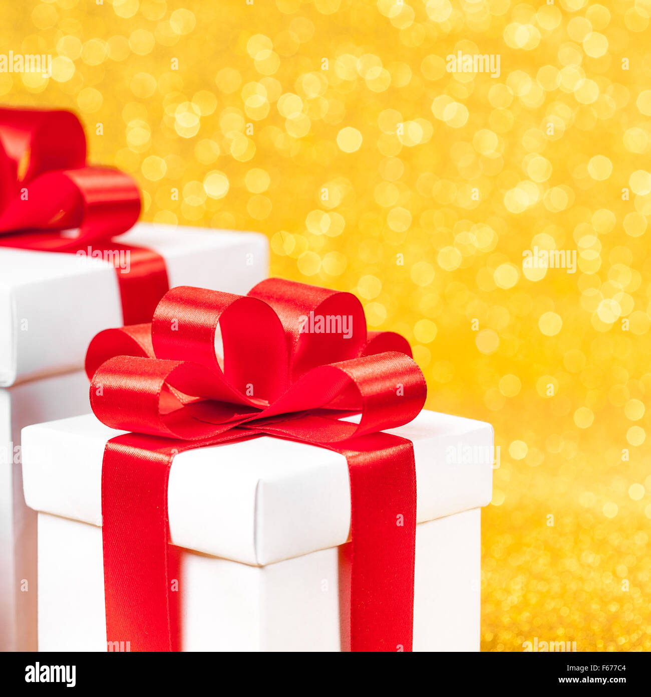 White gift box with red ribbon bow Stock Photo - Alamy