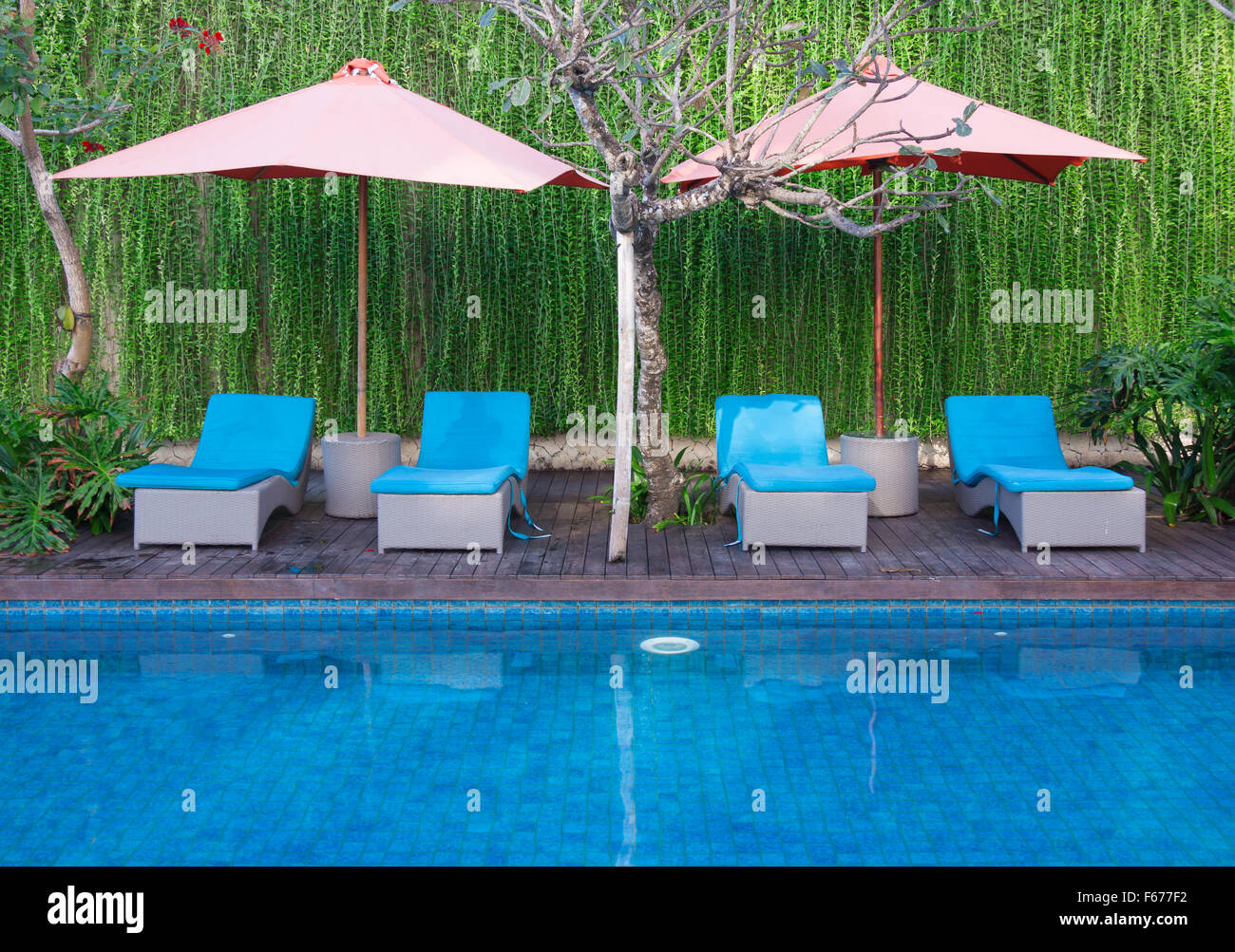 Relaxing Chairs Beside Of Swimming Pool Stock Photo