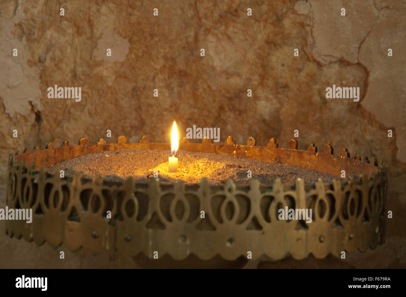 one candle burning in church Stock Photo Alamy