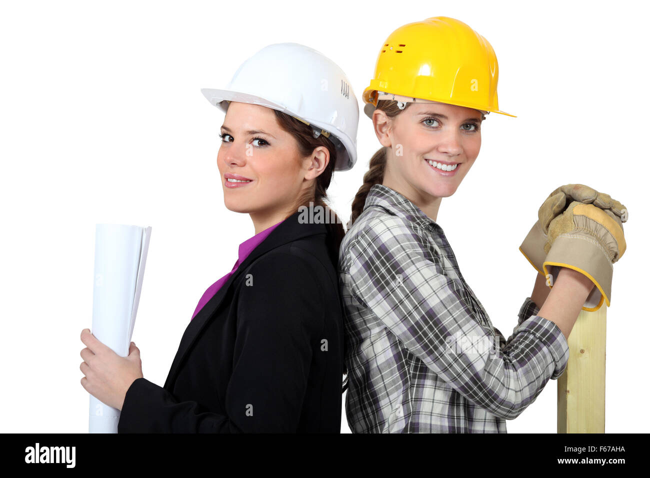 craftswoman and businesswoman standing back to back Stock Photo - Alamy