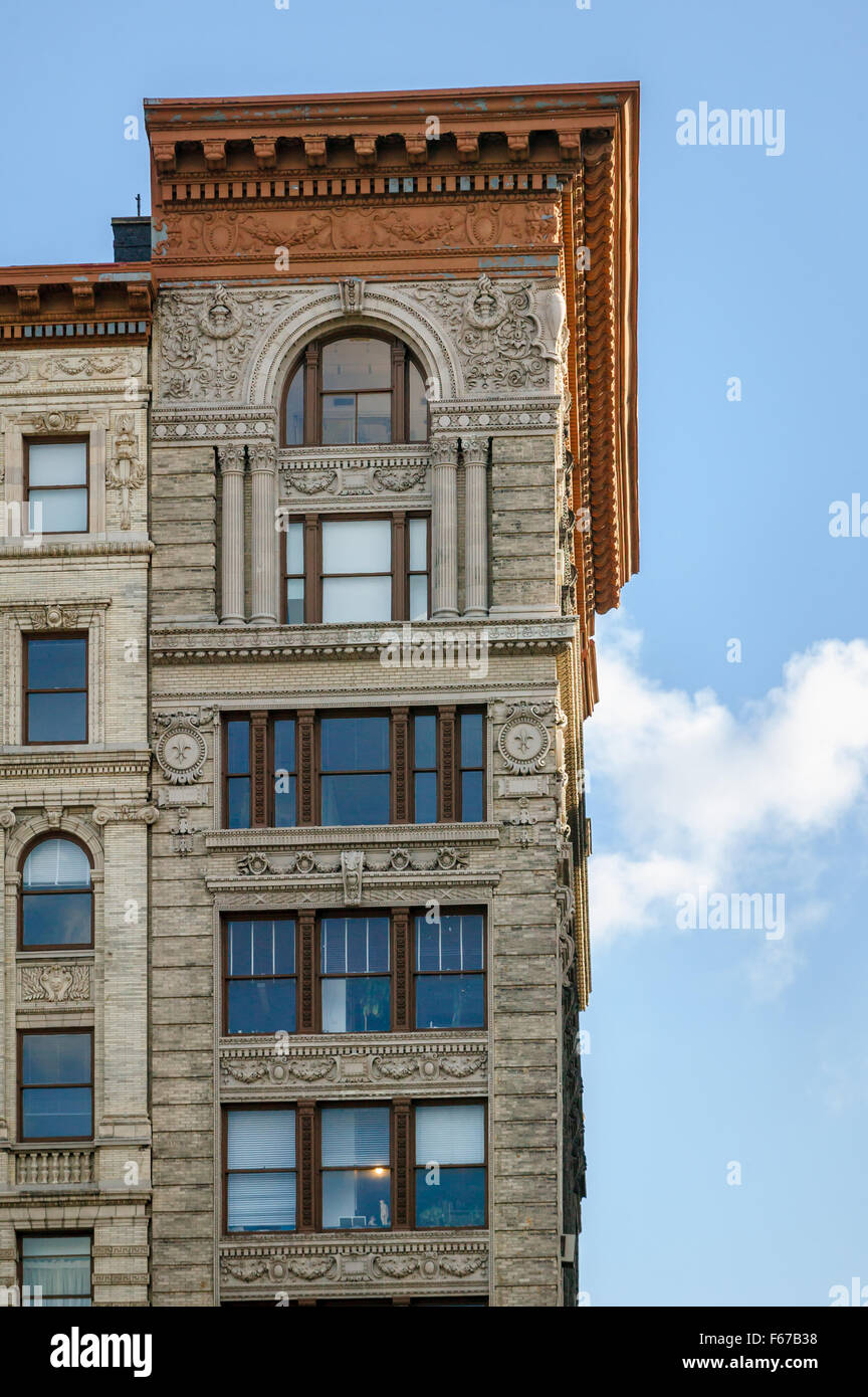 Architectural details (facade ornaments, cornice and entablature) on Soho building, Manhattan, New York City Stock Photo