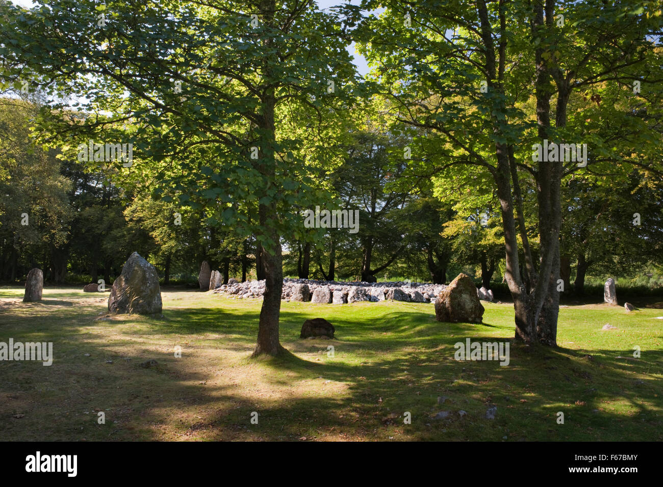 Looking WNW at Clava ring cairn surrounded by nine standing stones, four of them linked to the cairn by ray-like earthen banks. Stock Photo