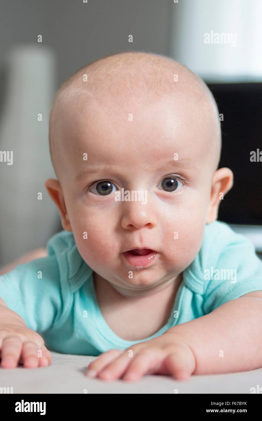 4 Month Old Baby Boy Is Laying On Her Tummy At Home Stock Photo - Alamy