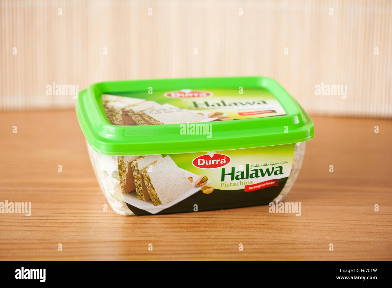 Durra Halawa pistachios dessert, sweet food product 350g in plastic green pack, Arabian product, one package in horizontal... Stock Photo