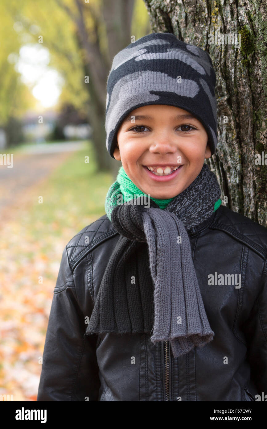 cute boy with autumn leaves in the park Stock Photo - Alamy