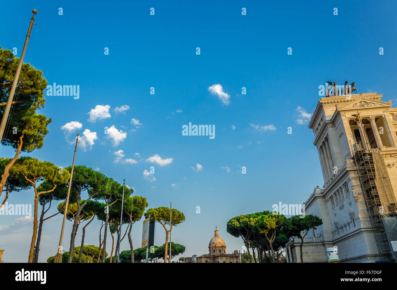 Sky and trees of Rome next to the Trajan's market and Altar of the Fatherland (Altare della Partia) before sunset. Stock Photo