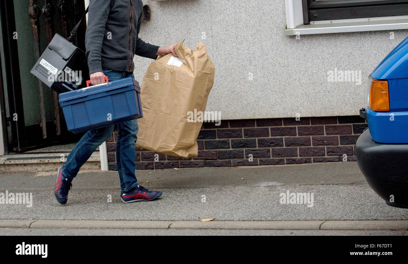 Crime scene investigators leaving a residential building in Wallenfels, Germany, 13 November 2015. The bodies of seven babies were found at the home in the small southern German town, triggering a major police inquiry. Photo: NICOLAS ARMER/dpa Stock Photo