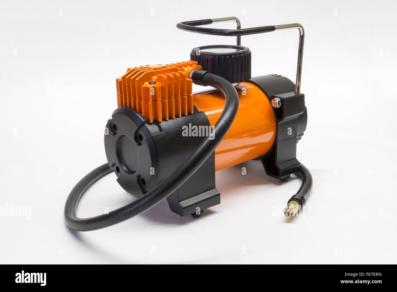 Orange electric compressor for car on light background Stock Photo