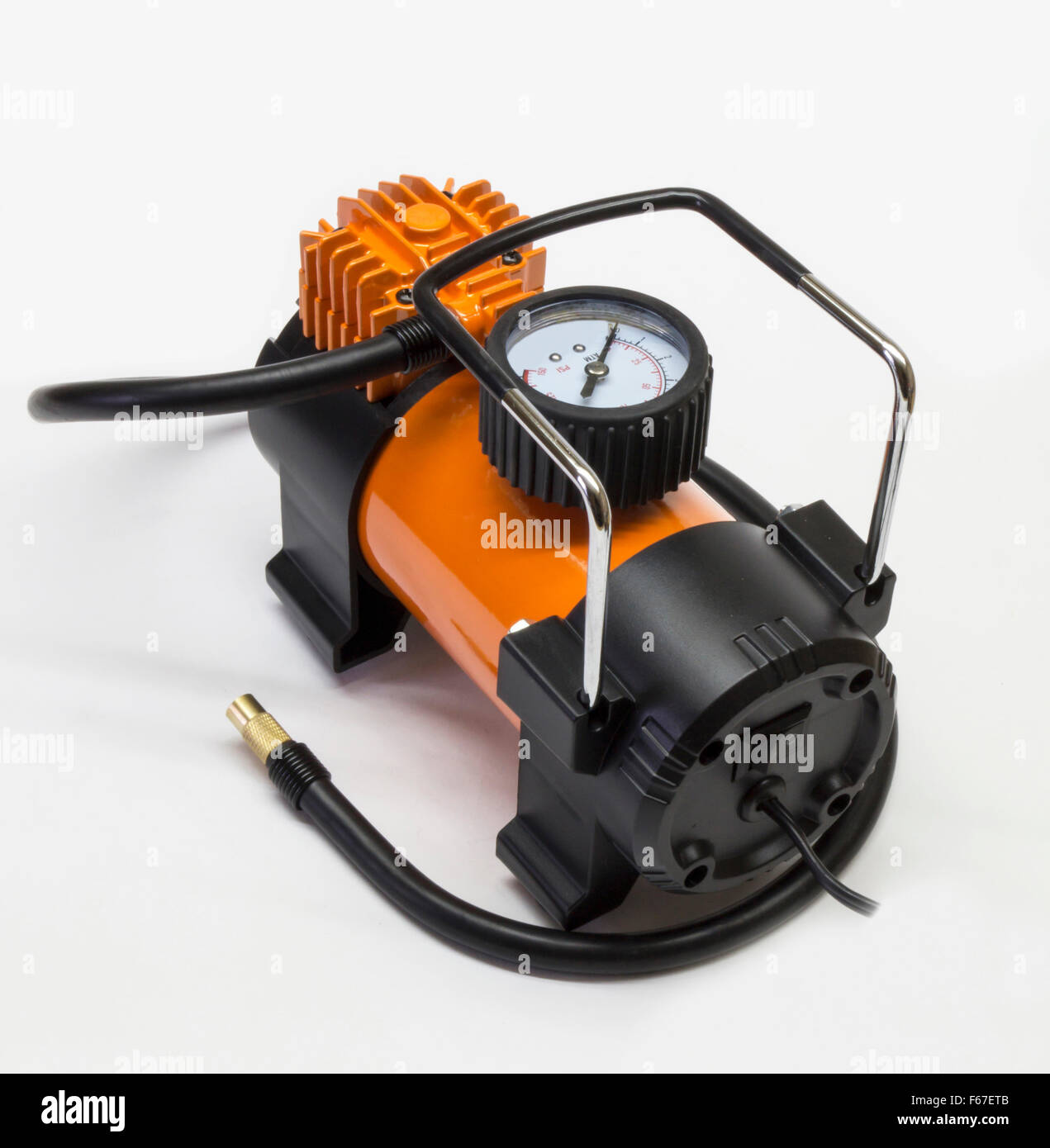 Orange electric compressor for car on light background Stock Photo