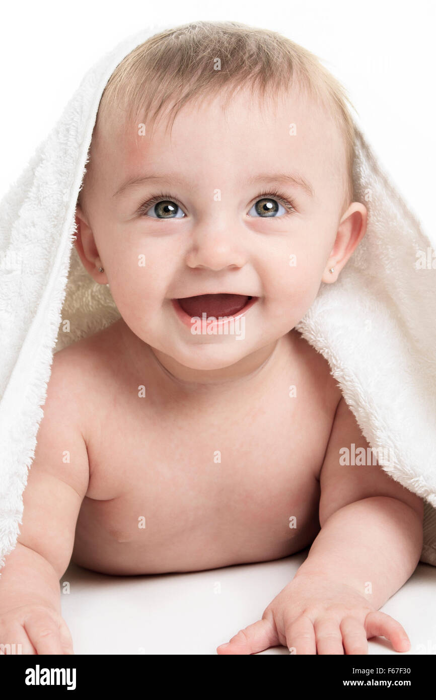 Sweet small baby covered with a towel Stock Photo Alamy