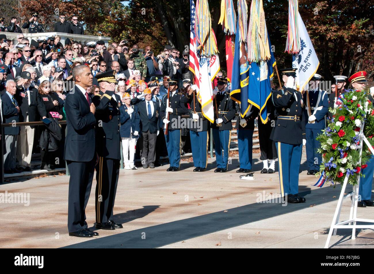 U.S. President Barack Obama with Major General Bradley Becker salutes during a wreath ceremony at the Tomb of the Unknowns in honor of Veterans Day at Arlington National Cemetery November 11, 2015 in Arlington, Virginia. Stock Photo
