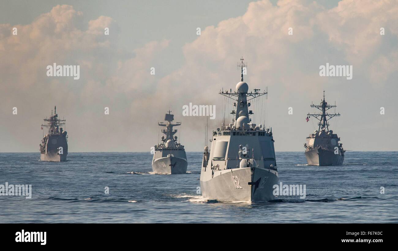 The U.S. Navy Ticonderoga-class guided missile cruiser USS Monterey in formation with the Chinese Navy Jiangkai-class frigate Yiyang, the Luyang II-class guided missile destroyer Jinan and the U.S. Navy Arleigh Burke-class guided missile destroyer USS Mason during joint exercises November 7, 2015 in the Atlantic Ocean. Stock Photo