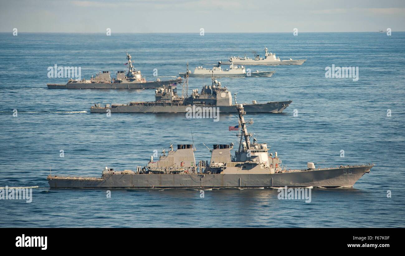 The U.S. Navy Ticonderoga-class guided missile cruiser USS Monterey in formation with the Chinese Navy Jiangkai-class frigate Yiyang, the Luyang II-class guided missile destroyer Jinan and the U.S. Navy Arleigh Burke-class guided missile destroyer USS Mason during joint exercises November 7, 2015 in the Atlantic Ocean. Stock Photo
