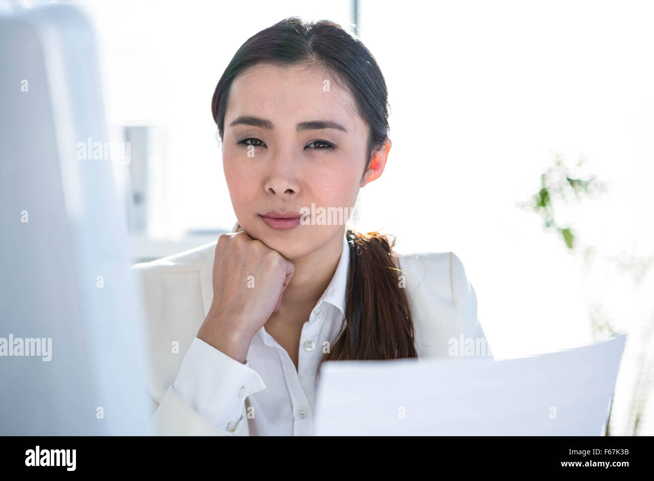 Smiling businesswoman using computer Stock Photo - Alamy