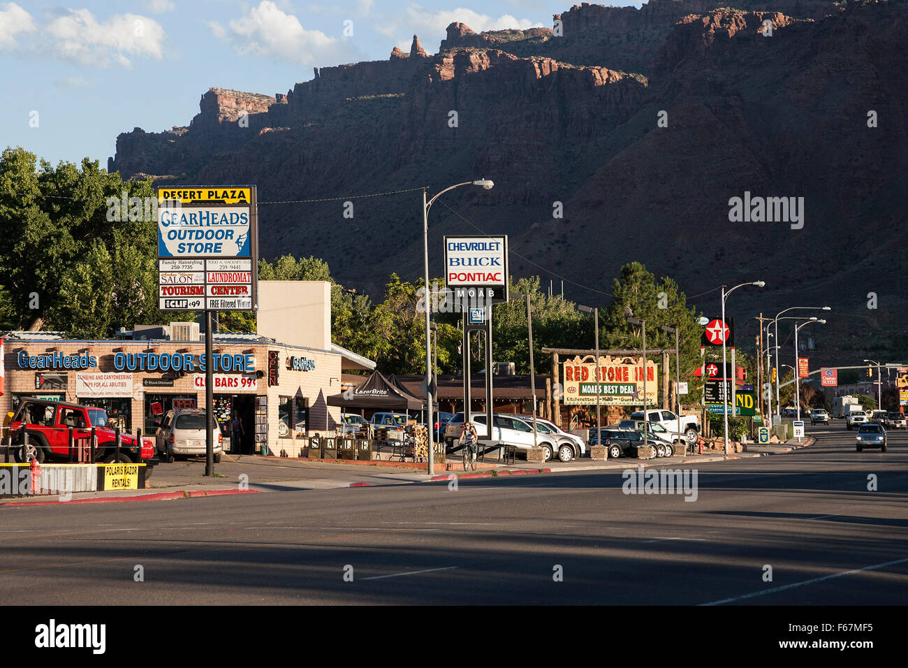 U.S. Route 191, street advertising in Moab, evening light, Utah, USA Stock Photo