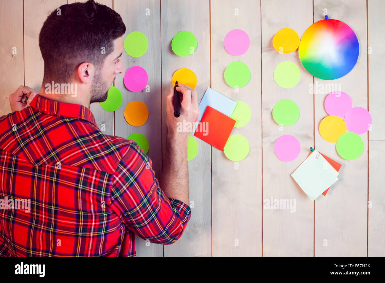 Creative worker using wall for brainstorm Stock Photo