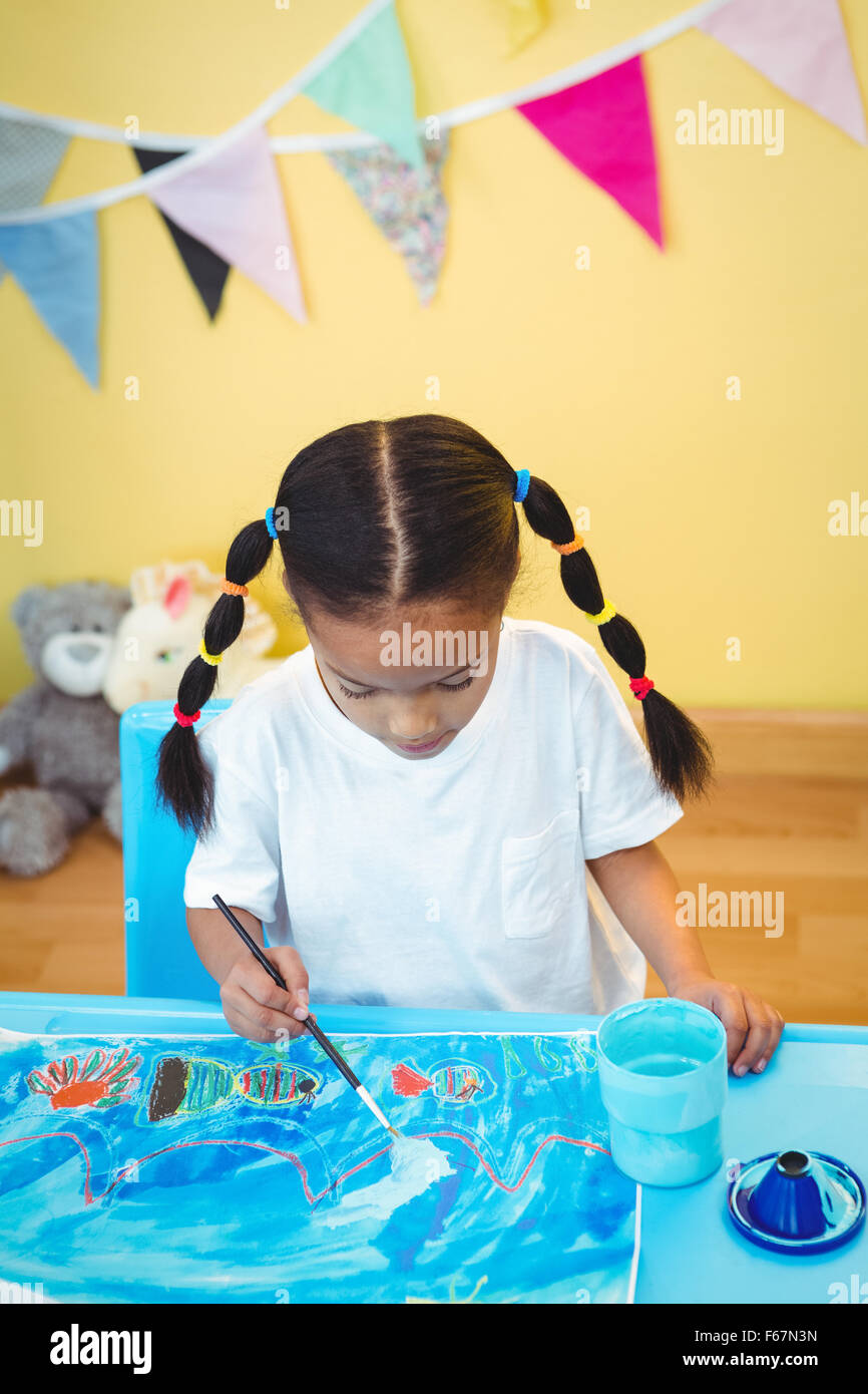 Girl painting on some paper Stock Photo - Alamy