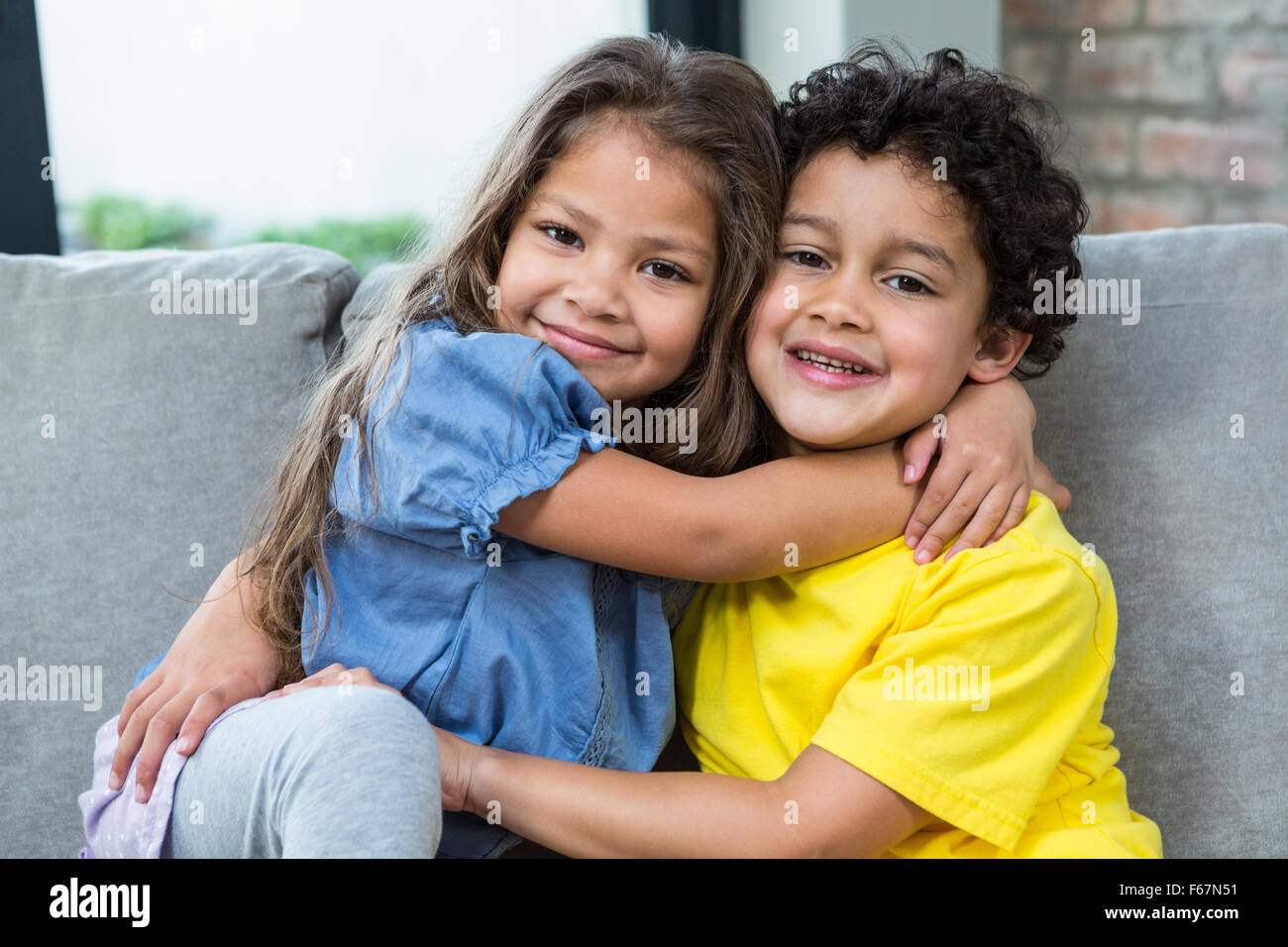 Cute siblings hugging Stock Photo